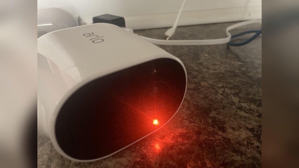 why is my arlo camera flashing orange